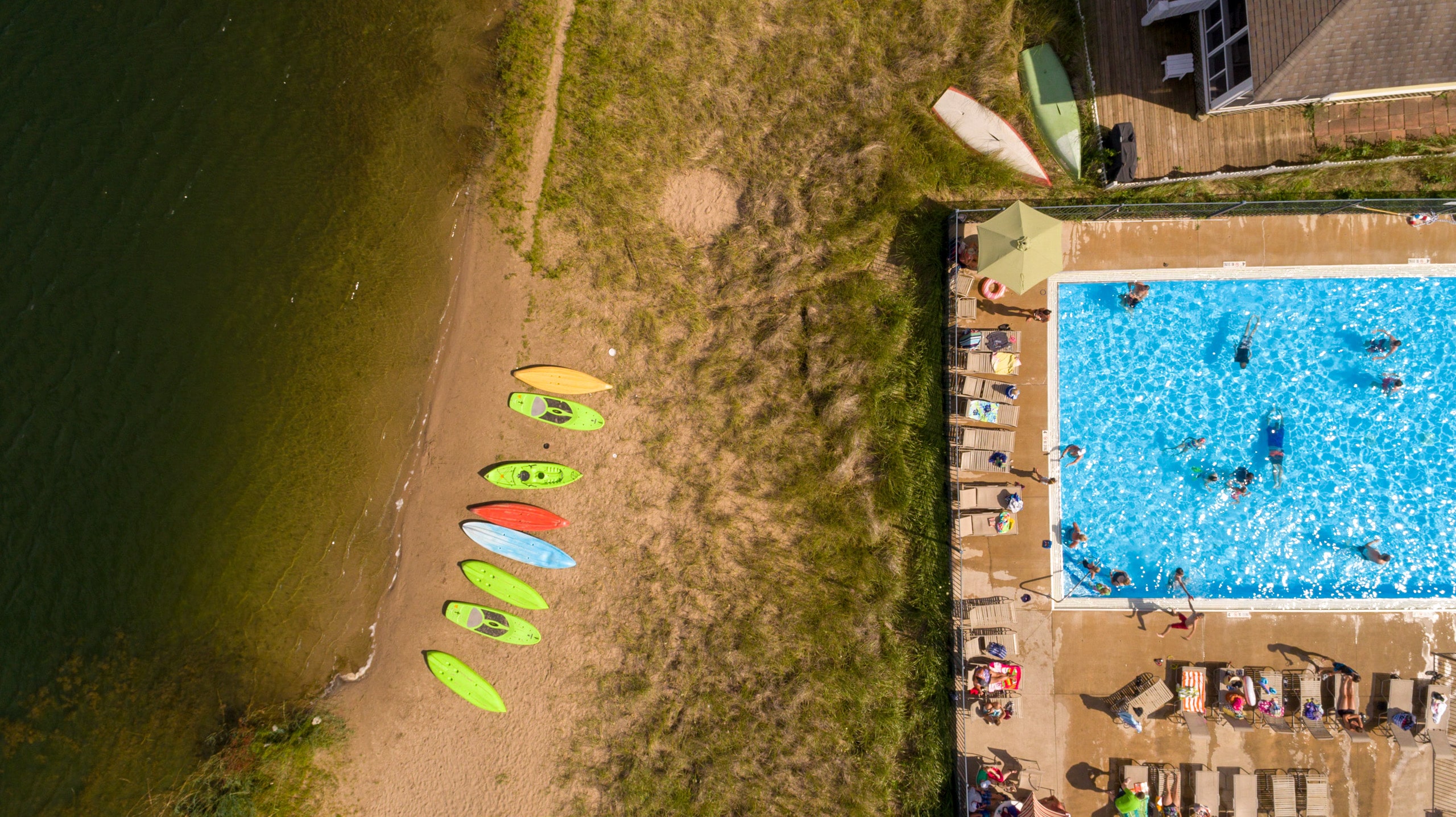 aerial view of beach and residential in ground pool